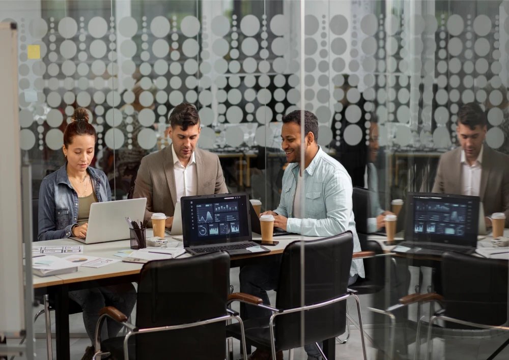 Modern office space in Greater Noida with professionals working in a collaborative environment and advanced workstations.